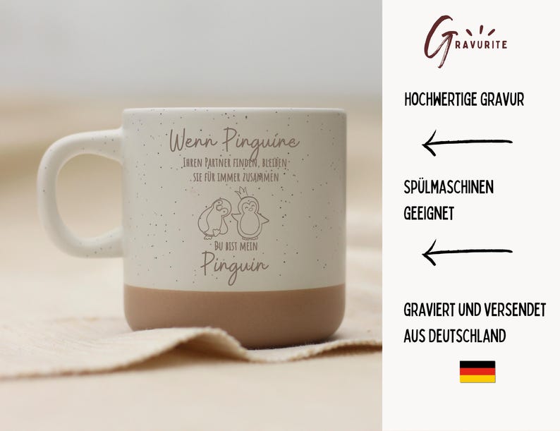 Puede incluir: Una taza de cer&aacute;mica blanca moteada con base y asa de color beige. La taza presenta una ilustraci&oacute;n de ping&uuml;ino y texto en alem&aacute;n. El texto incluye las palabras "Wenn Pinguine" y "Du bist mein Pinguin".