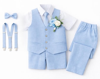 May include: A light blue vest, shorts, and long trousers set paired with a white short-sleeved shirt, a matching light blue tie, a bow tie, and suspenders. A floral boutonniere with blue and white flowers is pinned to the vest lapel.