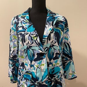 May include: A blue and white floral patterned blazer with a single button closure.