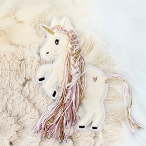 Einhorn mit Wollmähne rosa gold