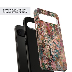 May include: A dual-layer phone case featuring a colorful floral pattern with pink, red, green, and blue flowers on a dark background. The case is shown in two parts, one solid black and one with the floral print, labeled SHOCK ABSORBING DUAL-LAYER DESIGN.