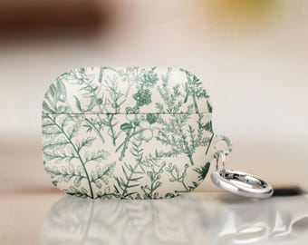 May include: A protective case for wireless earbuds featuring an off-white background with a detailed botanical print in dark green. The design displays various ferns, pine needles, and berries. A silver-toned metal ring is attached to the side.