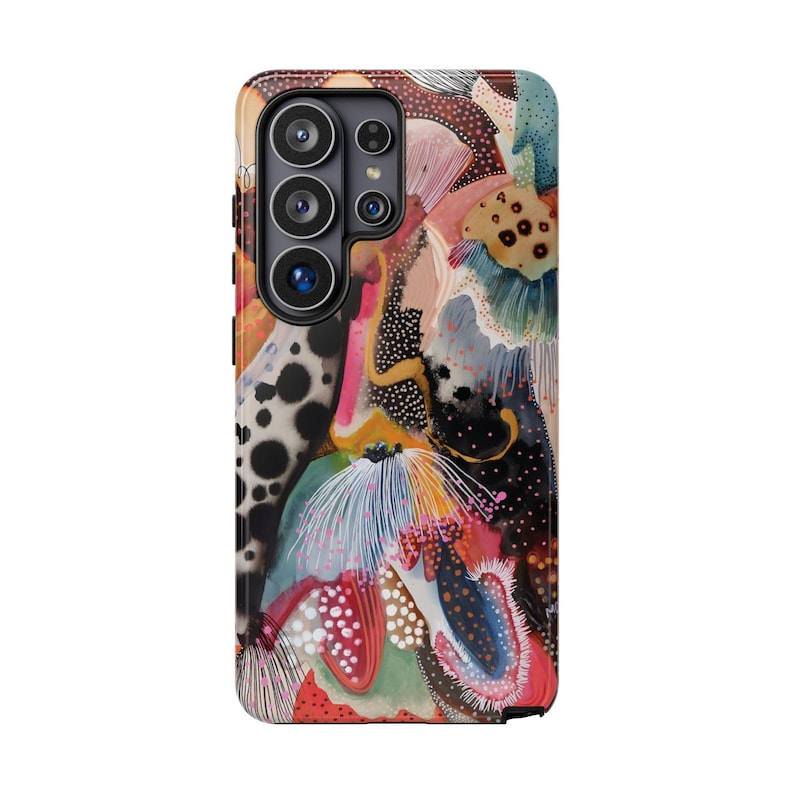 May include: A smartphone case featuring a vibrant, abstract design with layered organic shapes, fine line work, and a diverse color palette including black, white, pink, orange, and teal. The pattern includes dotted textures and fluid, brush-like strokes.