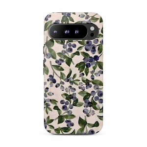 May include: A smartphone case featuring a repeating pattern of dark blue blueberries and green leaves on a light cream background. The case has a black horizontal camera bar at the top with three circular lens cutouts and a flash opening.