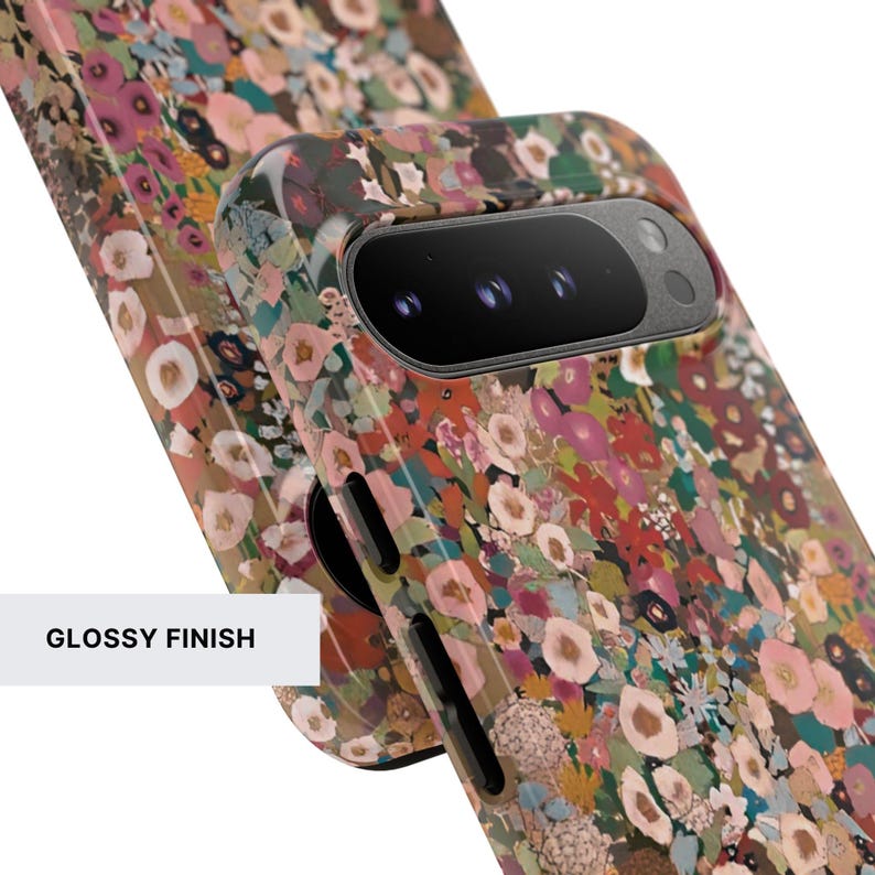 May include: A smartphone case with a glossy finish featuring a dense, multi-colored floral pattern in shades of pink, red, green, and white. The case has cutouts for the camera lens array and side buttons, showcasing a vibrant, detailed botanical print.