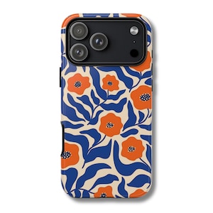 May include: A phone case with a floral pattern. The case features a cream-colored background with a repeating pattern of orange flowers and blue leaves. The phone's camera lenses are visible at the top.