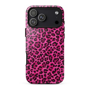 May include: A smartphone case featuring a vibrant hot pink background with a repeating black leopard print pattern. The case includes a rectangular black camera module cutout at the top, revealing three circular camera lenses and a flash.