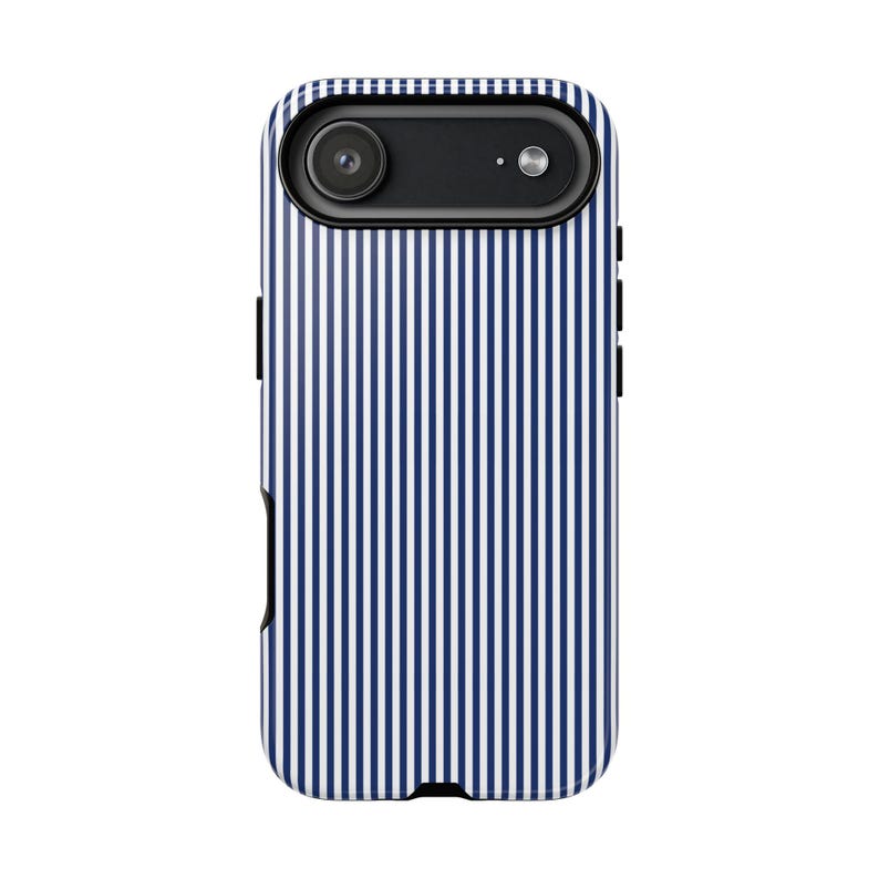 May include: A smartphone protective case featuring a vertical pinstripe pattern in dark blue and white. The case has a black camera housing at the top containing a circular lens and a small flash, with black side buttons visible on the edges.