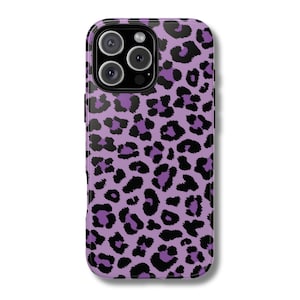 May include: A phone case with a purple leopard print design. The case has a glossy finish and features a camera module with three lenses. The leopard spots are black and purple, creating a bold and stylish look.