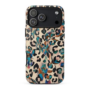 May include: A phone case with a leopard print design in tan, black, and brown. The case also features a floral pattern with blue, green, and purple accents. The phone case has a black camera module.