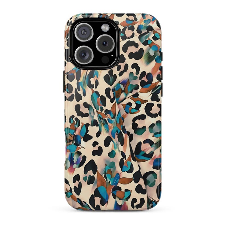 May include: A phone case with a cream-colored background and a pattern of black leopard spots and teal, blue, and brown floral accents. The case has a camera cutout and a glossy finish.