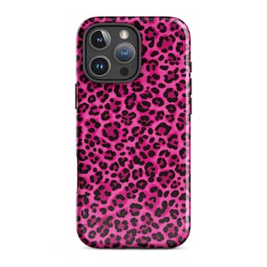 May include: A smartphone case featuring a vibrant hot pink background covered in a repeating black leopard print pattern. The case has a rectangular cutout at the top left corner for the camera lenses and flash, with black side buttons visible.