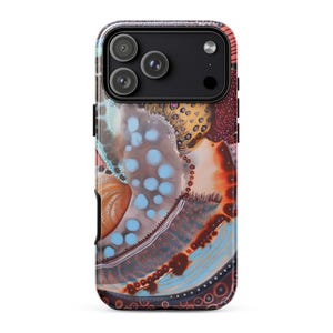 May include: A smartphone case featuring an abstract design with a mix of light blue, orange, and dark brown tones. The pattern includes various circular shapes, dotted textures, and flowing lines that cover the entire back surface of the device.