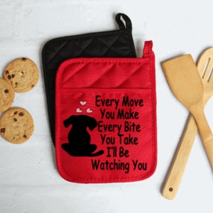 May include: Red and black quilted oven mitts with a black silhouette of a dog and the text "Every Move You Make Every Bite You Take I'll Be Watching You".