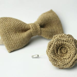 May include: A brown burlap bow tie with a matching brown burlap boutonniere.