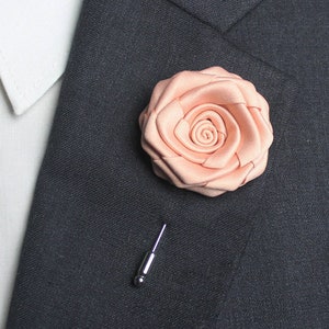 peach lapel pin