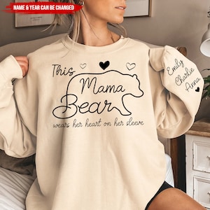 This Mama Bear Wears Her Heart On Her Sleeve, Personalized Sleeve Print Sweatshirt, Gift For Mom, Mothers Day Shirt, Custom Kids Name