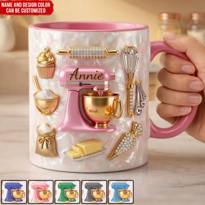 May include: A white ceramic mug with a pink handle and rim, decorated with baking-themed embellishments. Features a pink stand mixer, rolling pin, whisk, and other baking tools. The mug has the name "Annie" on it. The text "NAME AND DESIGN COLOR CAN BE CUSTOMIZED" is at the top.