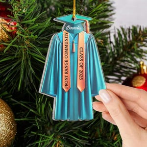 May include: A blue graduation cap and gown ornament with the text "Brenda" and "Front Range Community College Class of 2025" on it.