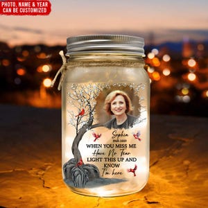 May include: A glass jar with a photo of a woman, a tree with red birds, and the text "Sophia 1968-2025 When you miss me Have No Fear Light this up and know I'm here".