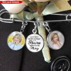 May include: A silver charm bracelet with three charms. One charm features a photo of a woman, another charm has the text "I know you'd be with me today if Heaven weren't so far away", and the third charm is a blank photo charm.