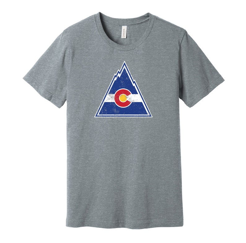 May include: A heather grey t-shirt with a distressed graphic of a mountain range and the Colorado state flag.