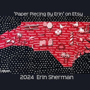 May include: A red and white paper piecing quilt depicting the state of North Carolina. The quilt is made up of individual squares with the names of cities and towns in North Carolina. The quilt is on a black background with white hearts. The text 'Paper Piecing By Erin' on Etsy' and '2024 Erin Sherman' are visible on the image.