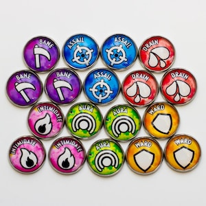 May include: A selection of circular game tokens with diverse designs and text. The tokens display words such as "Bane," "Assail," "Drain," "Intimidate," "Aura," and "Ward." Each token has a unique graphic and colour scheme, including purple, blue, red, pink, green, and yellow.