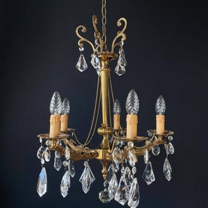 Luxurious antique chandelier with crystal pendants