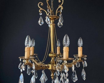 Luxurious antique chandelier with crystal pendants