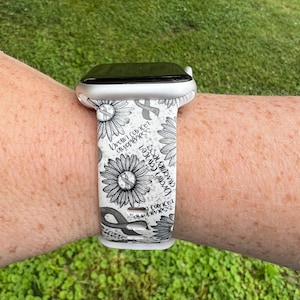 May include: White Apple Watch band with a black and white design featuring sunflowers and the text "Brain Cancer Awareness" and "Hope"