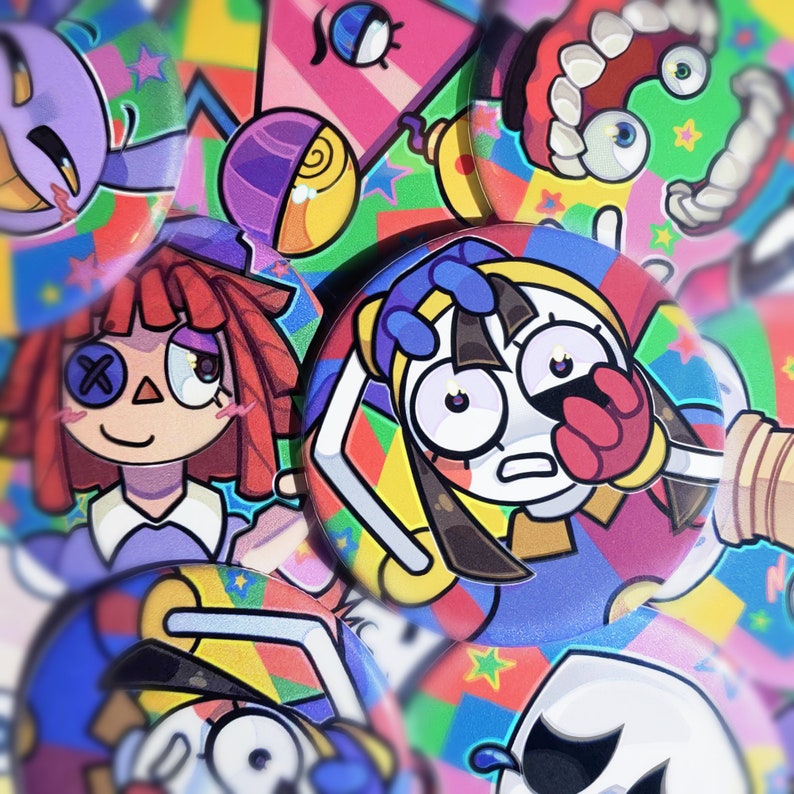 May include: A collection of colorful, round pins with cartoon characters and geometric patterns. The pins feature a variety of designs, including a girl with a red bow, a girl with a blue headband, and a character with a red mouth and a green eye.