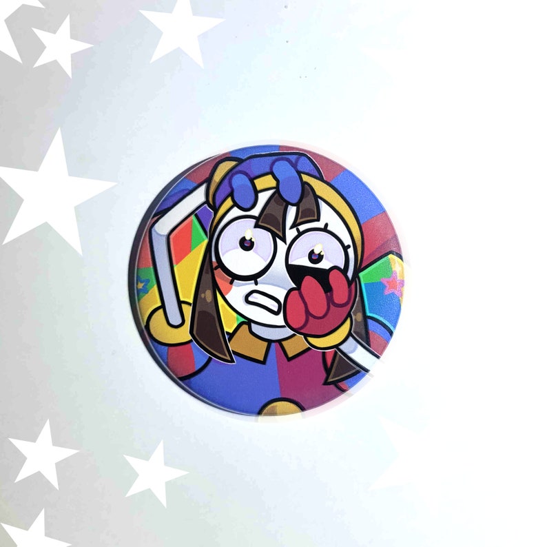 May include: A round button featuring a cartoon character with brown hair, blue eyes, and a red hand covering their face. The character is wearing a colorful costume with a blue, red, and yellow design. The button has a white background.