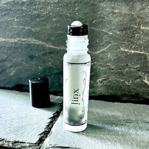 JINX Crystal Infused Perfume Oil | Pear & Oakmoss