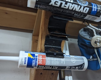 Soporte para tubos de silicona para calafatear