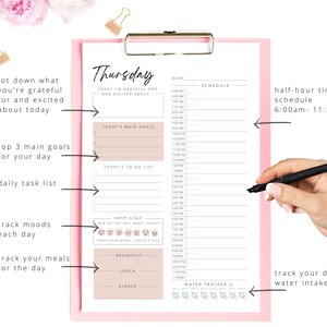 May include: A pink and white printable daily planner with sections for goals, tasks, mood tracking, meals, and water intake. The planner is labeled "Thursday" and includes the text "Today I'm grateful for and excited about..."