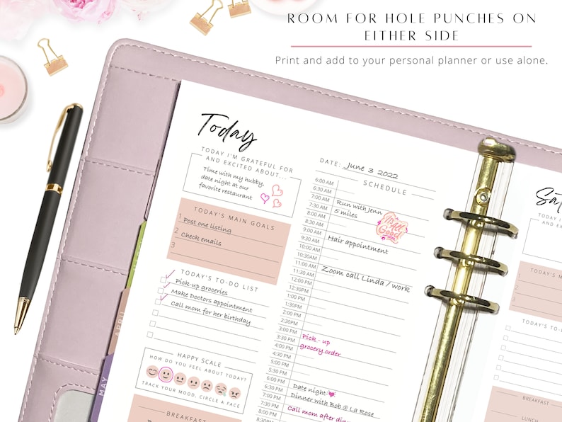 May include: A pink daily planner with a gold binder and a page that says "Today" with a to-do list, main goals, and a happy scale. The date is June 3, 2022.