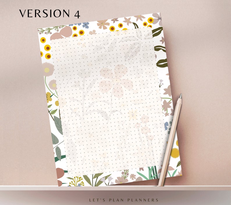 May include: A white planner page with a dotted grid pattern. The page is surrounded by a floral border with pink, yellow, and blue flowers on a white background. The text "LET'S PLAN PLANNERS" is at the bottom of the page.