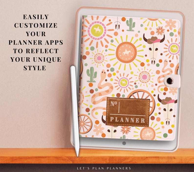 May include: A white planner cover with a colourful southwestern design featuring suns, cacti, snakes, and horses. The cover has a brown leather label that says "No. PLANNER".