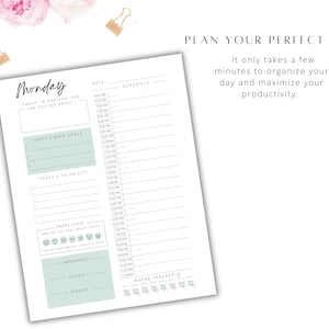 May include: A printable daily planner with a light green and white color scheme. The planner includes sections for scheduling, goal setting, to-do lists, a mood tracker, and a water tracker. The text "Monday" is at the top of the page.