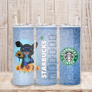 May include: Three stainless steel tumblers with lids and straws. The tumbler on the left has a blue and white glitter background with a cartoon Stitch character holding a sunflower. The tumbler in the middle has a blue and white glitter background with the text "STARBUCKS" in white. The tumbler on the right has a blue and white glitter background with a green Starbucks logo and the text "STARBUCKS COFFEE".