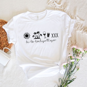 May include: White t-shirt with a black sun, palm trees, wine glass, beer glass, and the text "Si es contigo Mejor" printed on the front.