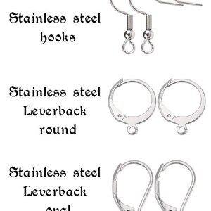 May include: A set of three different types of earring findings: stainless steel hooks, leverback round, and leverback oval.