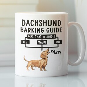 Könnte beinhalten: Weiße Keramik-Tasse mit dem Text "DACHSHUND BARKING GUIDE" und einem Flussdiagramm. Das Flussdiagramm enthält die Optionen "YES", "MAYBE" und "NO", mit einer Dackel-Illustration. Die Tasse hat einen weißen Griff.