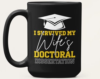 Funny PhD Graduation Coffee Mug: I Survived My Wife’s Doctoral Dissertation Husband Gift