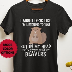 May include: Black t-shirt featuring a cartoon beaver and the text "I might look like I'm listening to you, but in my head I'm thinking about beavers".