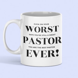 May include: White ceramic coffee mug with black text that reads "Even on your worst days you're still a great pastor. You are the best pastor ever!"