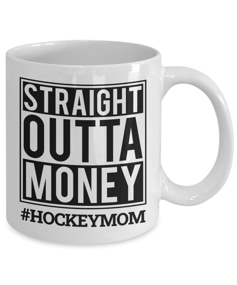 May include: White ceramic coffee mug with a black square graphic that says "STRAIGHT OUTTA MONEY #HOCKEYMOM".