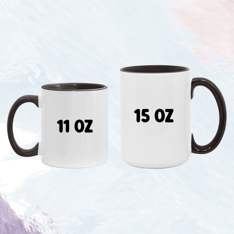 May include: Two ceramic coffee mugs with black rims. The mug on the left is 11 oz and the mug on the right is 15 oz.