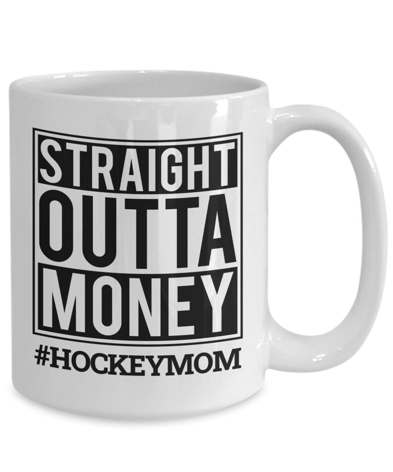 May include: White ceramic coffee mug with a black square design that says "STRAIGHT OUTTA MONEY #HOCKEYMOM".